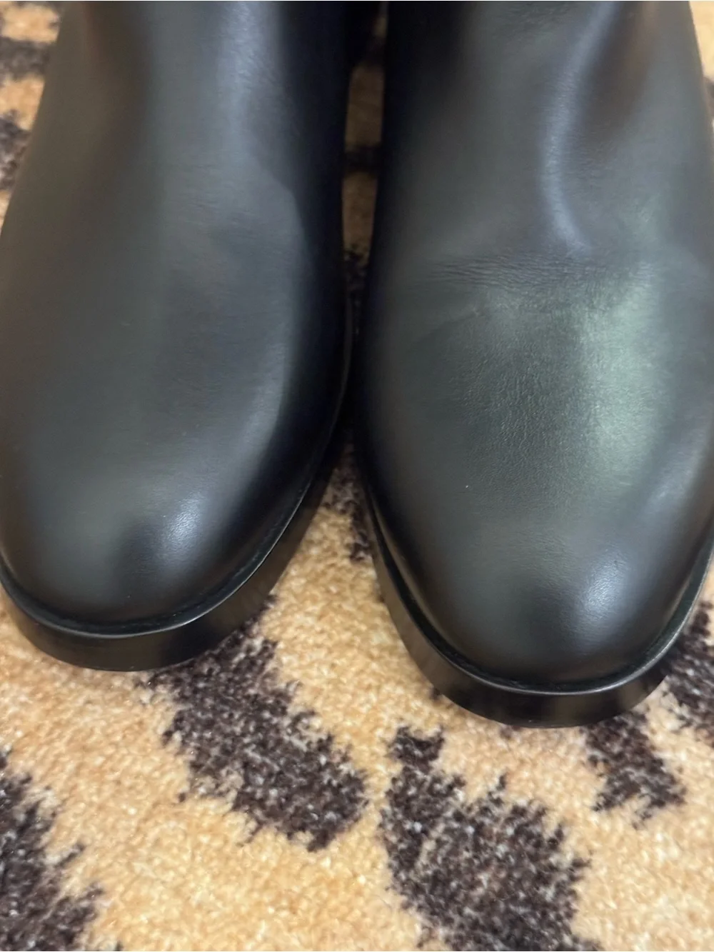 GUCCI Women’s Black Leather Knee-High Riding Boots with Gold Buckle